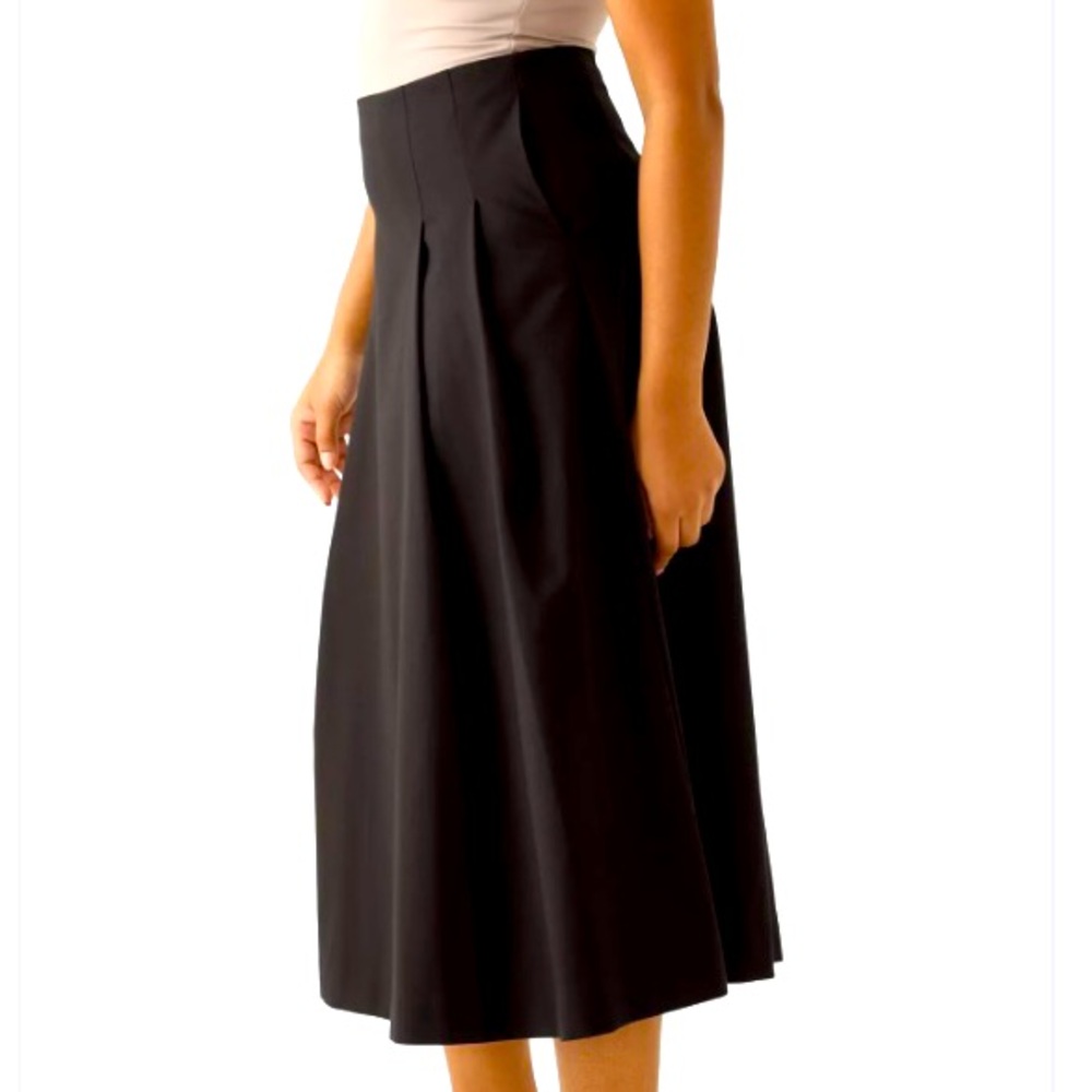 Washable wool, flared & pleated design for a chic, elegant yet versatile look.